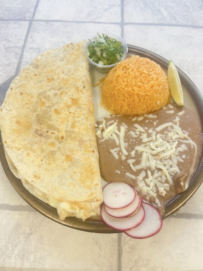 Quesadilla plate with rice, cheesy beans, cilantro, onion and lime